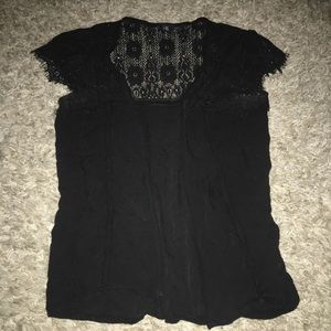 Open front short sleeve vest.